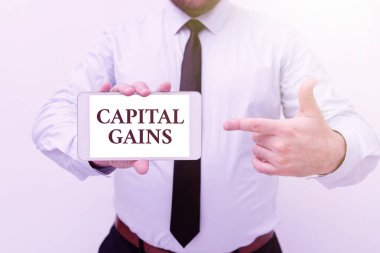 Metin Sermaye Kazançları yazılıyor. İşletme Genel Görünümü Tahviller Hisse Senetleri Gelir Vergisi Yatırım Fonları Yeni Teknoloji Fikirlerini Sunuyor Teknolojik Gelişme Tartışması