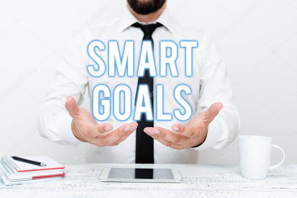 Text sign showing Smart Goals. Word Written on mnemonic used as a basis for setting objectives and direction Presenting Communication Technology Smartphone Voice And Video Calling