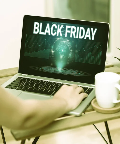 Handwriting text Black Friday. Business idea a day where seller mark their prices down exclusively for buyer Hand Resting On Laptop Top Of Table Beside Cup Working From Home. — Fotografia de Stock