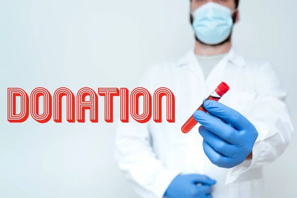 Writing displaying text Donation. Business idea something that is given to a charity, especially a sum of money Chemist Presenting Blood Sample, Scientist Analyzing Research Specimen — 图库照片