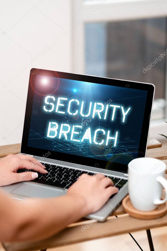 Text sign showing Security Breach. Business showcase unauthorized access of data gained by a malicious intruder Both Hands Typing On Laptop Next To Cup And Plant Working From Home.