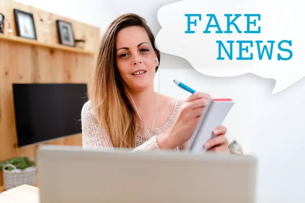 Inspiration showing sign Fake News. Internet Concept false information publish under the guise of being authentic news Watching Online Documentaries, Playing Internet Games With Friends — стокове фото