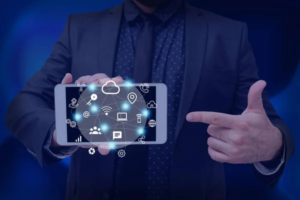 Man holding Screen Of Mobile Phone Showing The Futuristic Technology. Businessman Presenting Cell Phone Inside Room Presenting Modern Automation. — Foto Stock