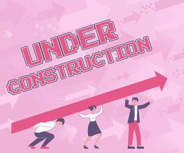 Text sign showing Under Construction. Concept meaning building that is unfinished but actively being worked on Four Colleagues Drawing Standing Holding Large Arrow For Success. — Stock Photo, Image