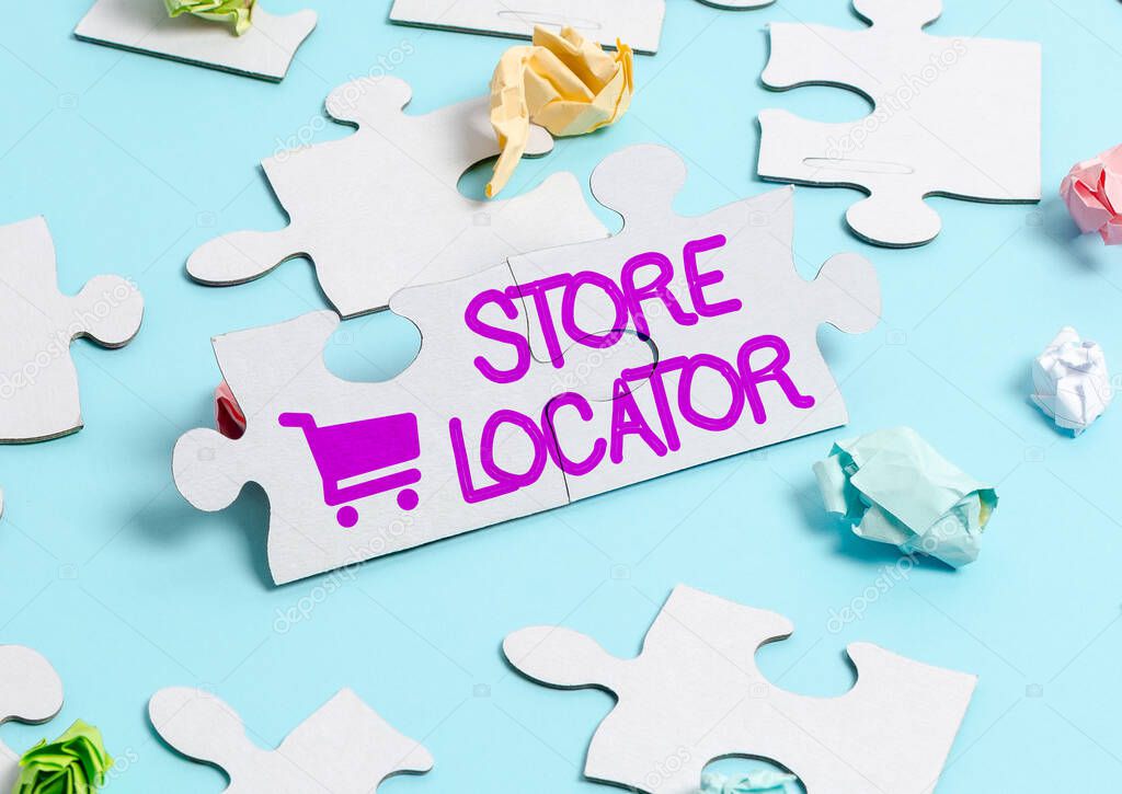 Conceptual display Store Locator. Business idea to know the address contact number and operating hours Building An Unfinished White Jigsaw Pattern Puzzle With Missing Last Piece