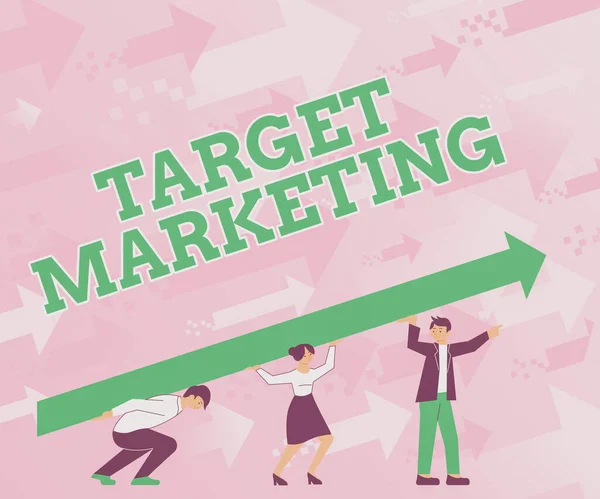 Text showing inspiration Target Marketing. Business showcase Market Segmentation Audience Targeting Customer Selection Four Colleagues Drawing Standing Holding Large Arrow For Success.
