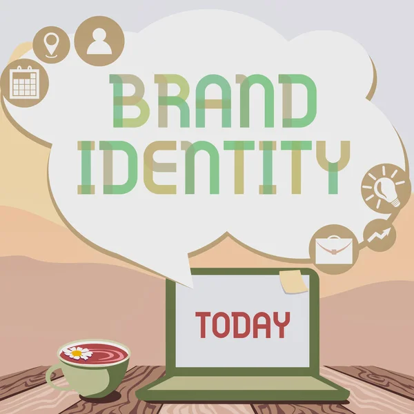 Концептуальная подпись Brand Identity. Бизнес-концепция видимые элементы бренда, которые идентифицировать и различать ручной типирования на ноутбуке рядом с кофе кружку и завод работает из дома. — стоковое фото