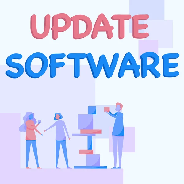 Написання тексту Update Software. Conceptual photo replacing program with a newmore version of same product Three Colleague Standing help one with Building Blocks. — стокове фото