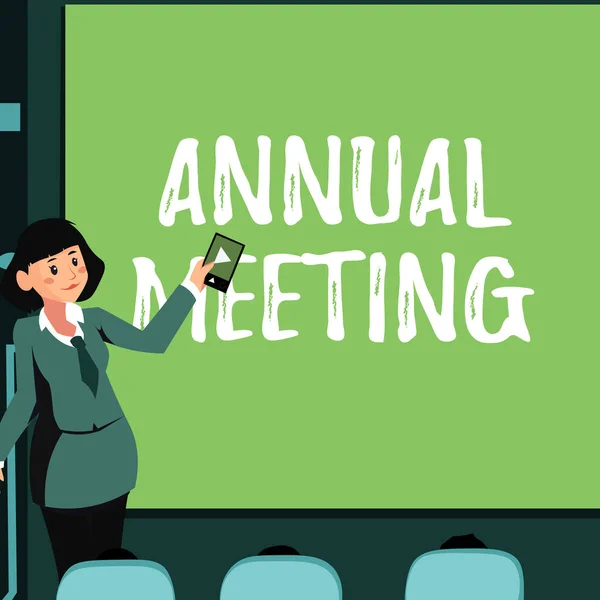 Text caption presenting Annual Meeting. Business approach Yearly gathering of an organization interested shareholders Woman Holding Remote Control Presenting Newest Ideas On Backdrop Screen.