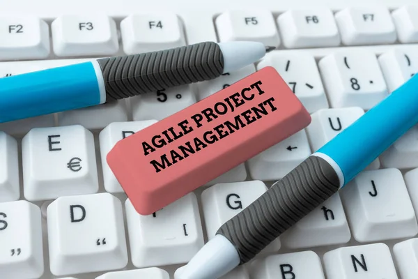 Hand writing sign Agile Project Management. Concept meaning management methodology from traditional to modern technology Downloading Online Files And Data, Uploading Programming Codes — Stock Photo, Image
