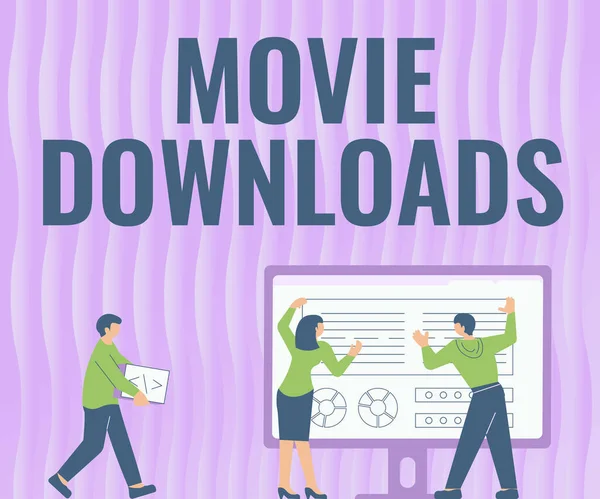 Sign displaying Movie Downloads. Business approach transfers entire film for local storage and later use Colleagues Drawing Standing Beside Table Projection Graph Chart — Stock Photo, Image