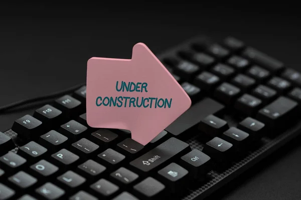 Inspiration showing sign Under Construction. Business overview building that is unfinished but actively being worked on Typing Online Website Informations, Editing And Updating Ebook Contents — Stock Photo, Image