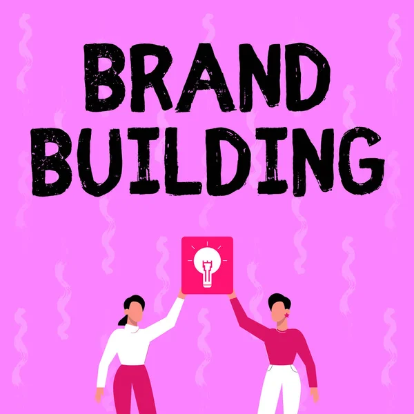 Conceptuele weergave Brand Building. Zakelijke aanpak Bewustmaking creëren Onderneming oprichten en promoten Twee collega 's Holding Lamp Presentatie New Achievement Reach. — Stockfoto