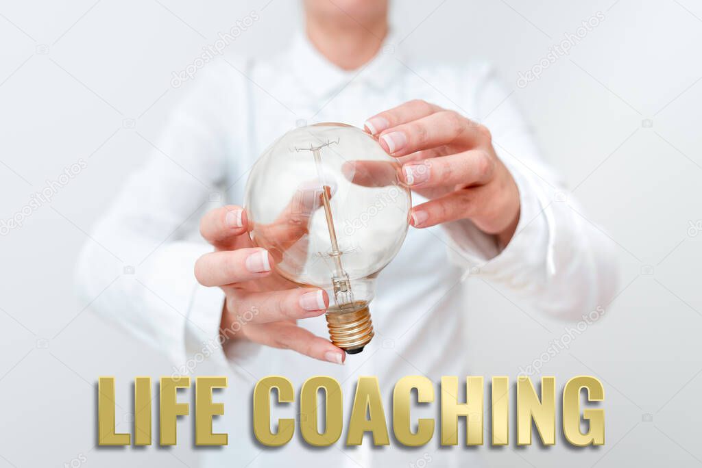 Hand writing sign Life Coaching. Business approach Improve Lives by Challenges Encourages us in our Careers Lady in outfit holding lamp with two hands presenting new technology ideas