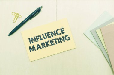 Kavramsal manşet Etki Pazarlaması. İş dünyasının kilit liderlerini marka sürmek için kullanmak, Fiyakalı Okul Malzemeleri, Öğrenme Koleksiyonları ve Yazma Aletleri 'ni pazarlamak için mesajdır.,