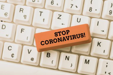 Coronavirus 'u durdurun mesajı yazılıyor. COVID19 vakalarının azaltılması için mücadele eden İnternet Kavramsal Hastalık Bilinci Kampanyası Tarihi Geçmiş Web sitelerinin Düzeltilmesi, İnternet Bağlantısının Korunması