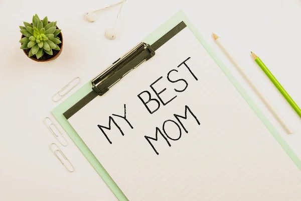 Conceptual caption My Best Mom. Concept meaning Admire have affection good feelings love to your mother Multiple Assorted Collection Office Stationery Photo Placed Over Table — Stock Photo, Image