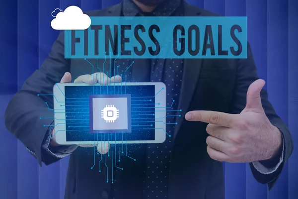 Schreiben mit Text Fitness Goals. Geschäftskonzept Fett verlieren Muskelaufbau Stärker werden Konditionierung Mann hält Bildschirm des Mobiltelefons zeigt die futuristische Technologie. — Stockfoto