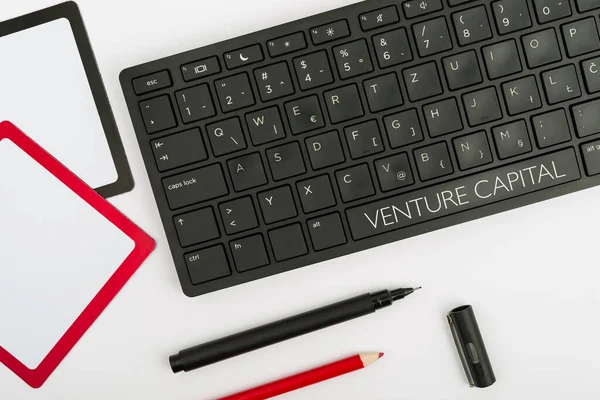 Text sign showing Venture Capital. Internet Concept financing provided by firms to small early stage ones Computer Keyboard And Symbol.Information Medium For Communication.