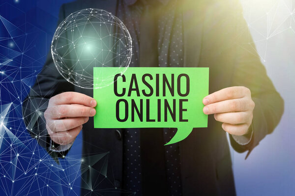 Text showing inspiration Casino Online. Word Written on Computer Poker Game Gamble Royal Bet Lotto High Stakes Businessman in suit holding paper represents global innovative thinking.