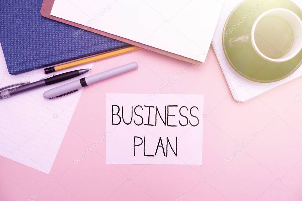 Conceptual display Business Plan. Business showcase Structural Strategy Goals and Objectives Financial Projections Office Supplies Over Desk With Keyboard And Glasses And Coffee Cup For Working