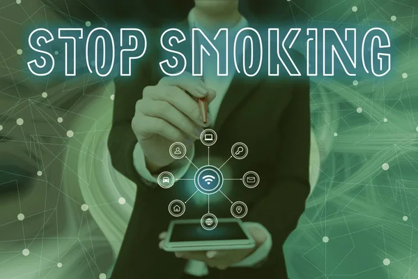 Hand writing sign Stop Smoking. Business concept Discontinuing or stopping the use of tobacco addiction Lady Pressing Screen Of Mobile Phone Showing The Futuristic Technology — 스톡 사진