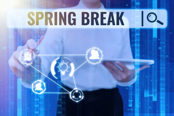 Sign displaying Spring Break. Concept meaning Vacation period at school and universities during spring Lady in suit poins pen holds tablet achieving global innovative thinking. — Stockfoto