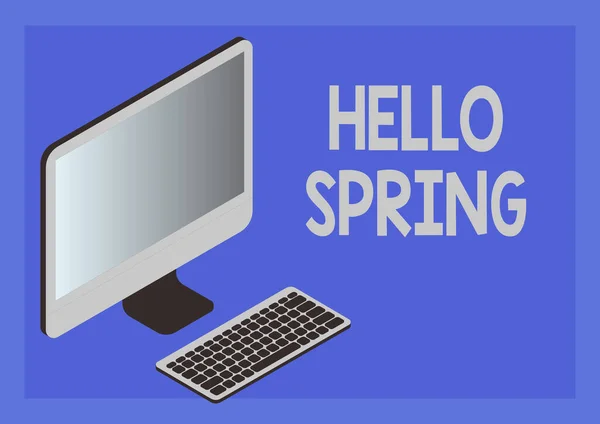 Вывеска "Hello Spring". Концепция означает приветствие сезона после зимы Цветение цветов Монитор с клавиатурой, символизирующей онлайн связь между коллегами. — стоковое фото