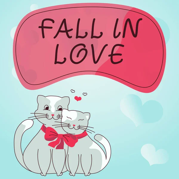 Sign displaying FALL IN LOVE. Business concept Charmed or captivated with someone Valentines Day Cats tied together with bow represent passionate couple with love goals. — 스톡 사진