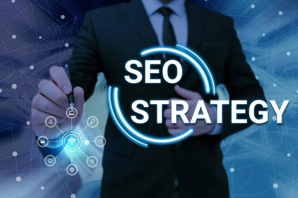 Sign displaying Seo Strategy. Word for Techniques and tactics to increase the visitors of a website Man holding Screen Of Mobile Phone Showing The Futuristic Technology. — Stockfoto