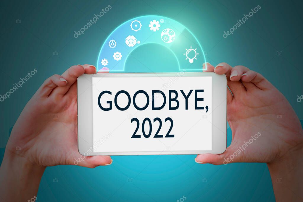 Text showing inspiration Goodbye 2022. Concept meaning New Year Eve Milestone Last Month Celebration Transition Hands holding tablet presenting innovative ideas symbolizing technology.