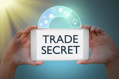 Sign displaying Trade Secret. Business showcase Confidential information about a product Intellectual property Hands holding tablet presenting innovative ideas symbolizing technology.