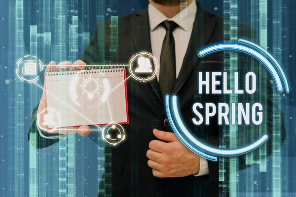 Writing displaying text Hello Spring. Conceptual photo Welcoming the season after the winter Blossoming of flowers Businessman in suit holding notepad representing innovative thinking. — Fotografia de Stock