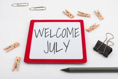Hand writing sign Welcome July. Internet Concept Calendar Seventh Month 31days Third Quarter New Season Computer Keyboard And Symbol.Information Medium For Communication.