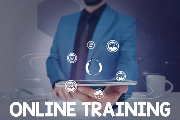 Handwriting text Online Training. Business approach Take the education program from the electronic means Businessman in suit holding tablet symbolizing successful teamwork. — Photo