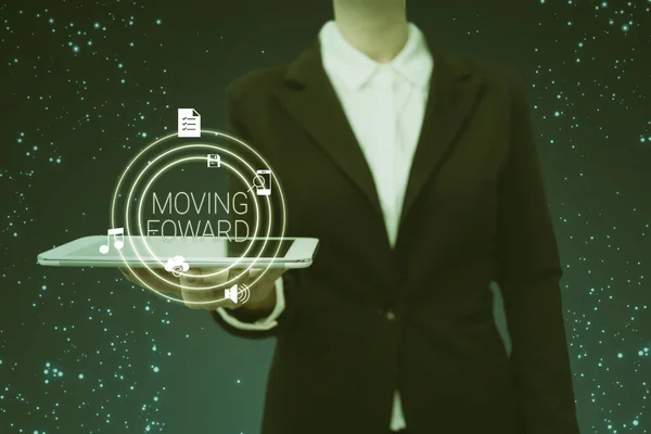 Text sign showing Moving Foward. Concept meaning Towards a Point Move on Going Ahead Further Advance Progress Lady in suit holding electrical tablet presenting innovative thinking. — Stock Photo, Image