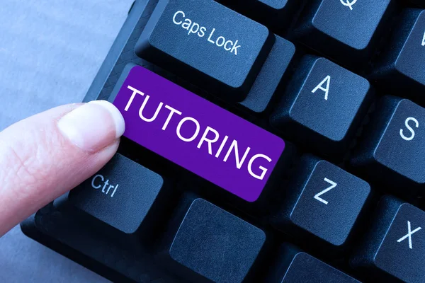 Text sign showing Tutoring, Business idea An act of a person employed to administer knowledge to someone -48930