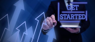 İlham kaynağı gösteren metin Başlayın, Sözcük şu anda takım elbiseli bir iş adamından başarılı bir takım çalışmasını simgeleyen açık avuç içiyle görev çalışmasına başlamasını istiyor.