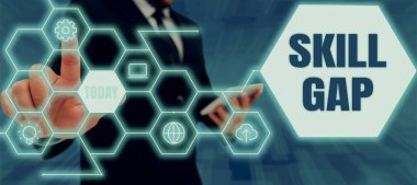 Skill Gap sunan metin başlığı, İş konsepti bir kişinin zayıf ya da takım elbiseli bayanın elinde başarılı takım çalışmalarını simgeleyen kalem tutmasının sınırlandırılması anlamına gelir..