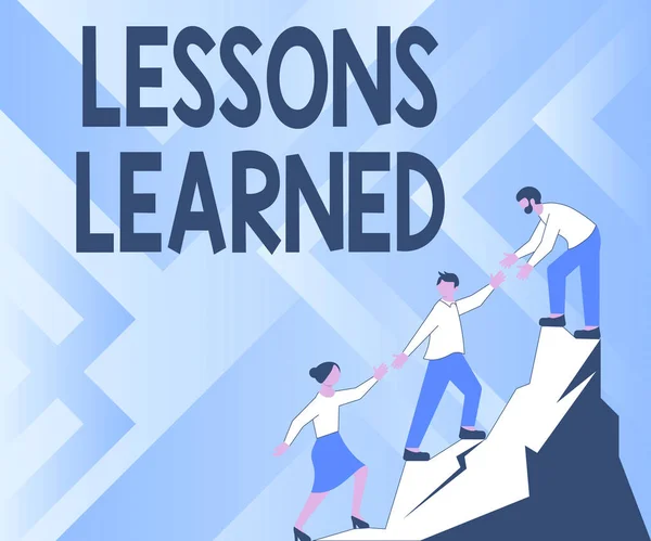 Text sign showing Lessons Learned, Conceptual photo Promote share and use knowledge derived from experience Colleagues Climbing Upwards Mountain Reaching Success Presenting Teamwork.