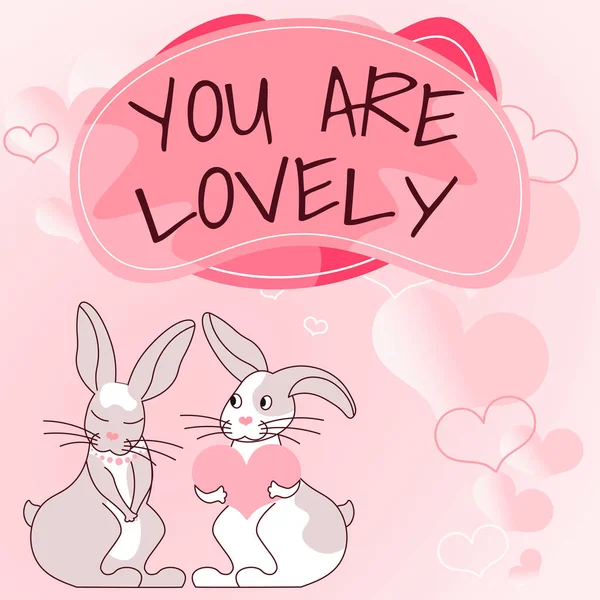 Sign displaying YOU ARE LOVELY, Business showcase Compliment for someone with whom you fall in love Bunnies with heart shaped gifts demonstrate passionate lovers with presents