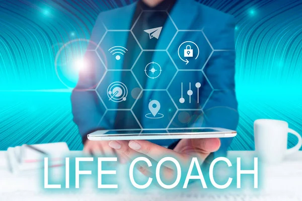 Sign displaying Life Coach, Word for A person who advices clients how to solve their problems or goals Businessman in suit holding tablet symbolizing successful teamwork.