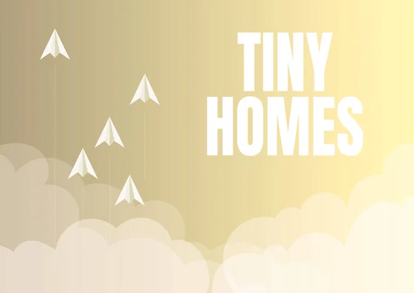 Conceptual caption Tiny Homes, Internet Concept houses contain one room only or two and small entrance Cheap Five paper airplanes flying up sky surrounded with clouds achieving goals.