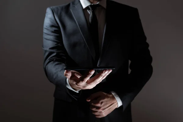 Businessman Holding Tablet Both Hands Presenting Important Data — Stock fotografie