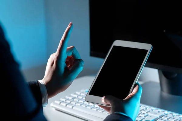 Businesswoman Holding Tablet And Pointing With One Finger On Important News