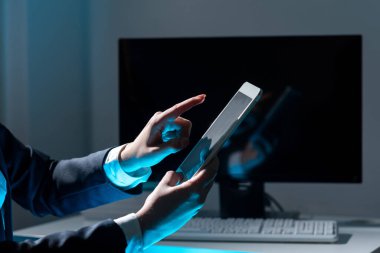 Businesswoman Holding Tablet And Pointing With One Finger On Important News