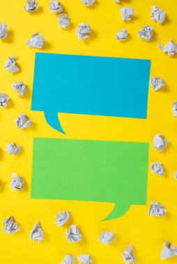 Paper Wraps Placed Around Two Speech Bubbles With Important Informations.