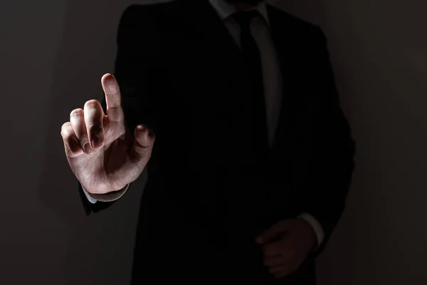 Businessman In Suit Pointing With One Finger On Important Message.