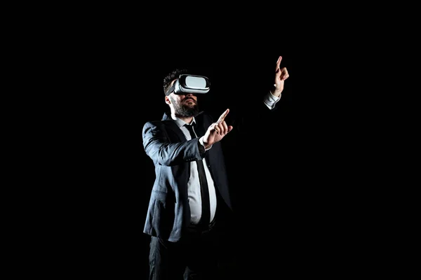 Businessman Wearing Suit Gesturing And Wearing Virtual Reality Simulator.