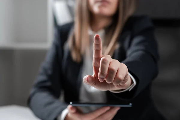 Woman Holding Tablet And Pointing With One Finger On Important Idea.